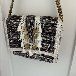 Chic Black and White Woven Bag with Gold Accents
